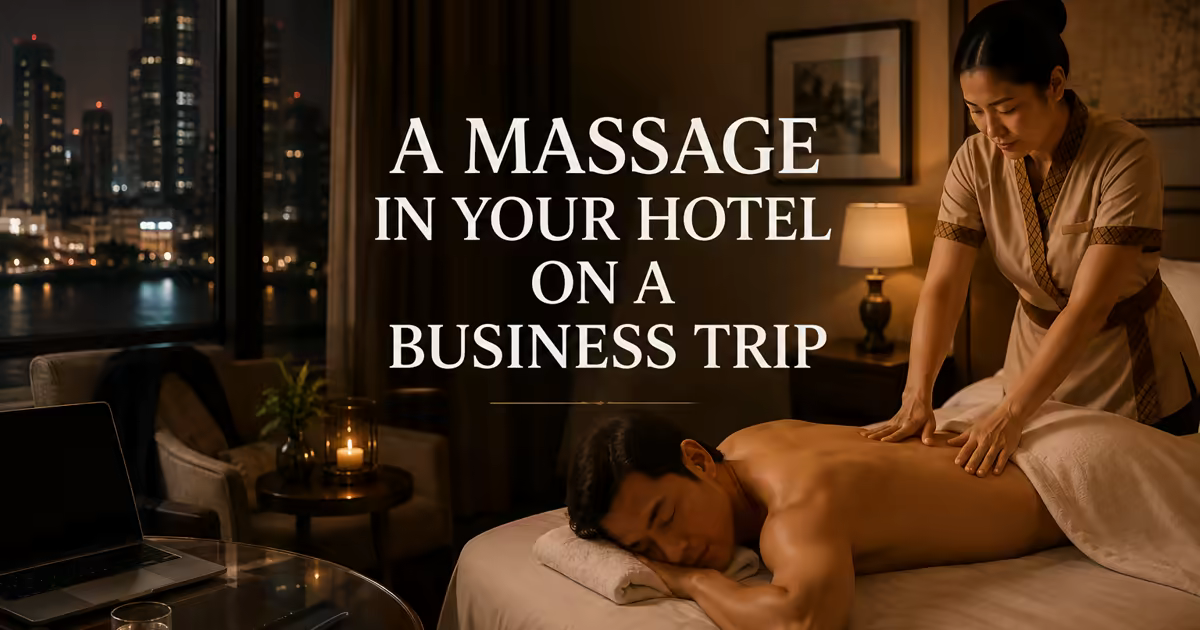 A business traveller receiving an in-room back massage in a Bangkok hotel room at night, a laptop on the table and the city skyline behind