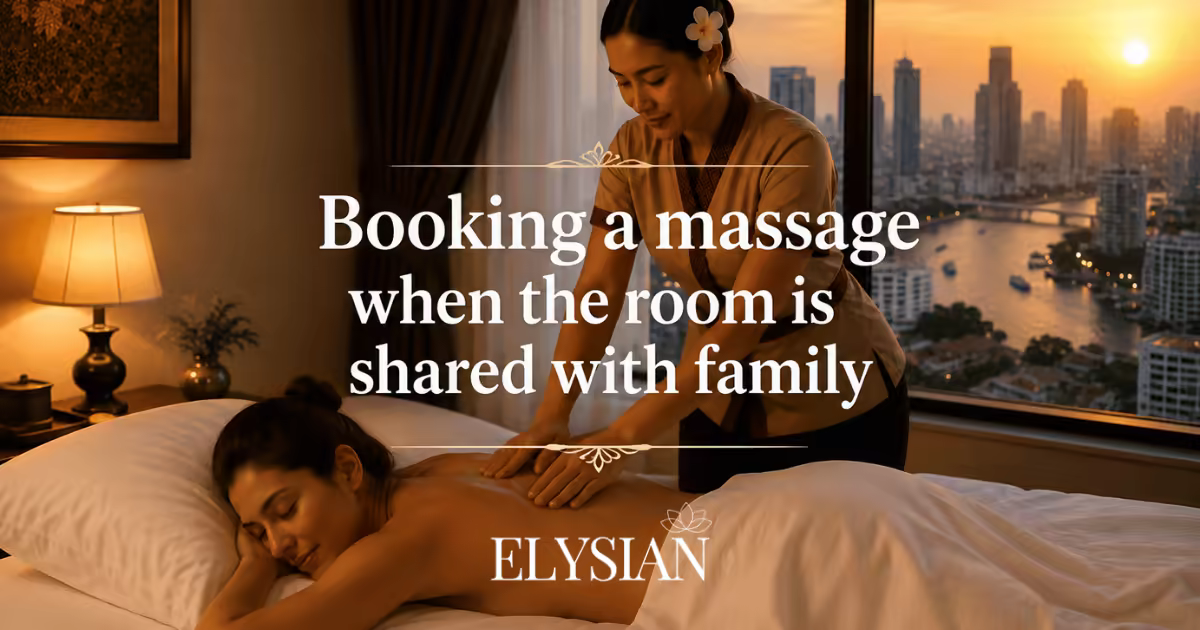 A woman receiving a professional in-room massage on a hotel bed in Bangkok at sunset