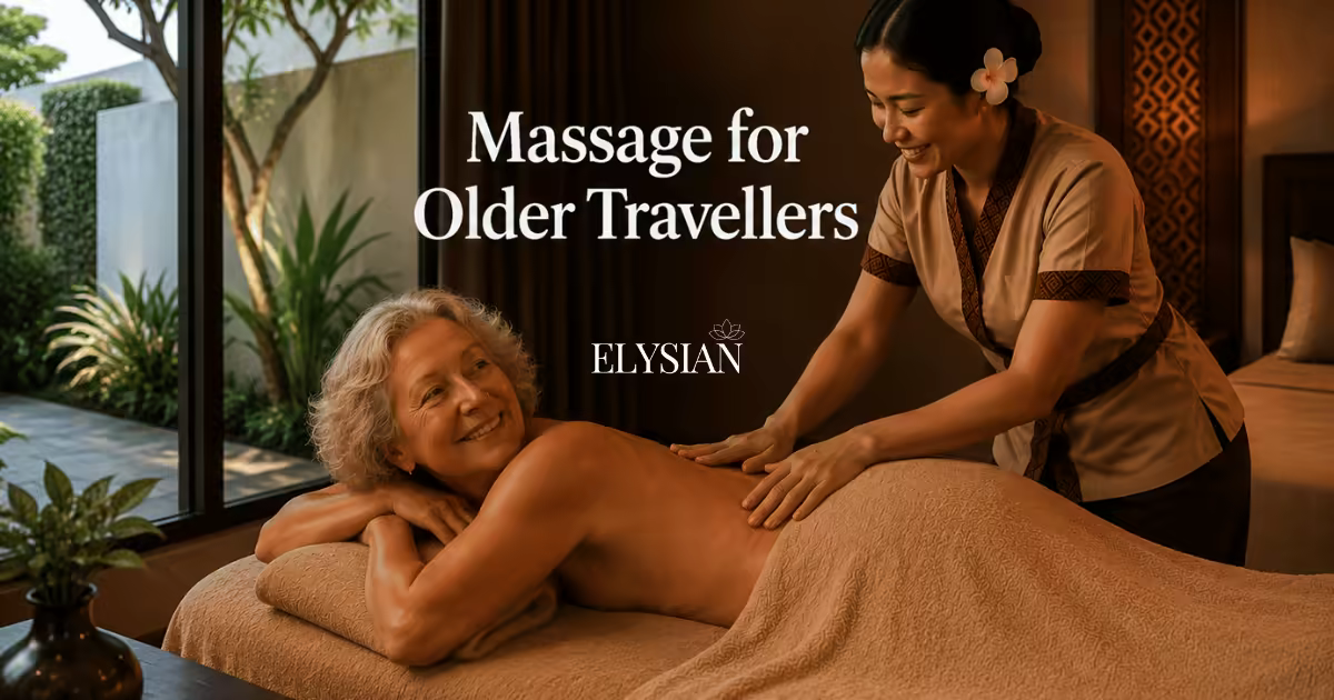 An older traveller receiving a gentle in-room massage from a Thai therapist in a Bangkok hotel room