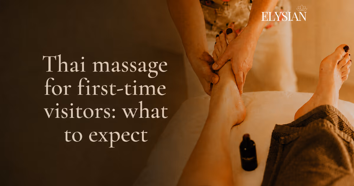 Tourist receiving a traditional Thai massage with assisted stretching in a Bangkok hotel room